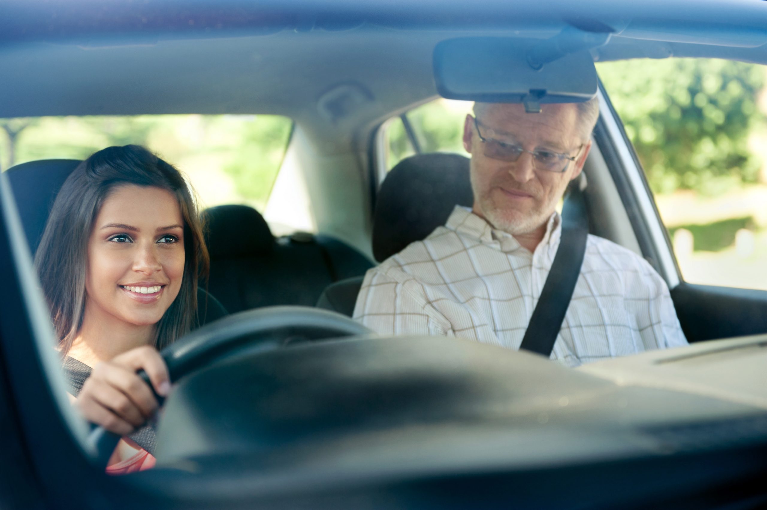 female learner driver with male driving instructor