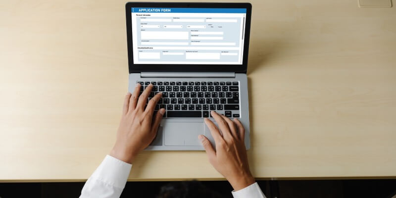 Aerial view of application form on a laptop