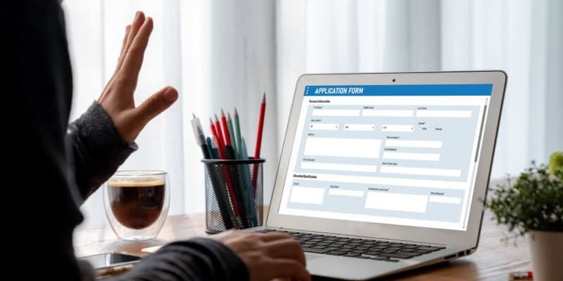 Laptop screen with an application form displayed on screen
