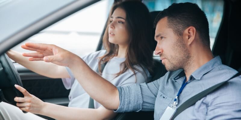 Instructor gesturing ahead to guide a learner