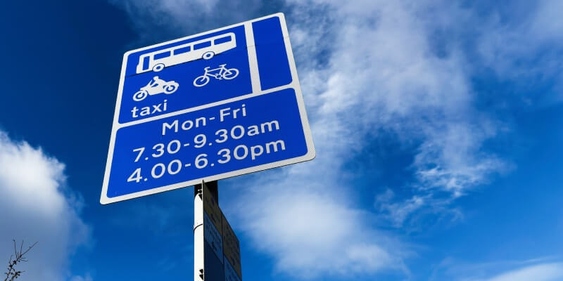 UK sign with bus lane times displayed